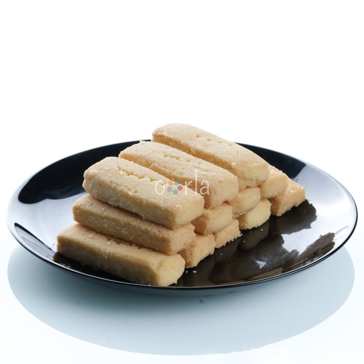 Close-up view of the butter biscuit placed on a black plate